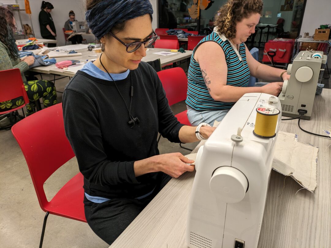 Human using a Sewing Machine