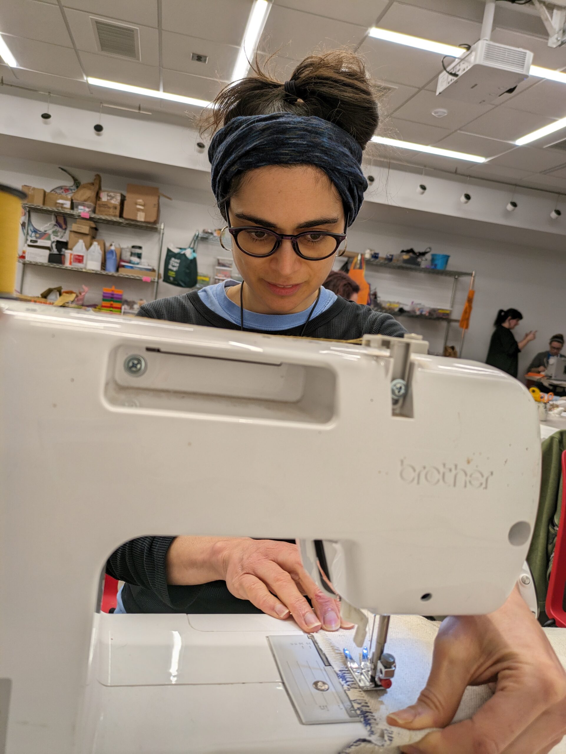 Woman using sewing machine